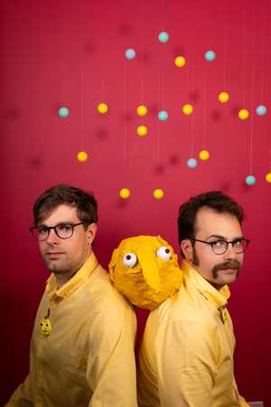 A photo from the Robo Bingo photo shoot. Lloyd and Peter seated with Mr. Bing's head between them.